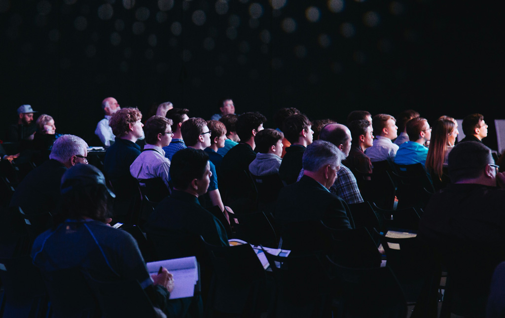 Crowd of event people watching a presentation